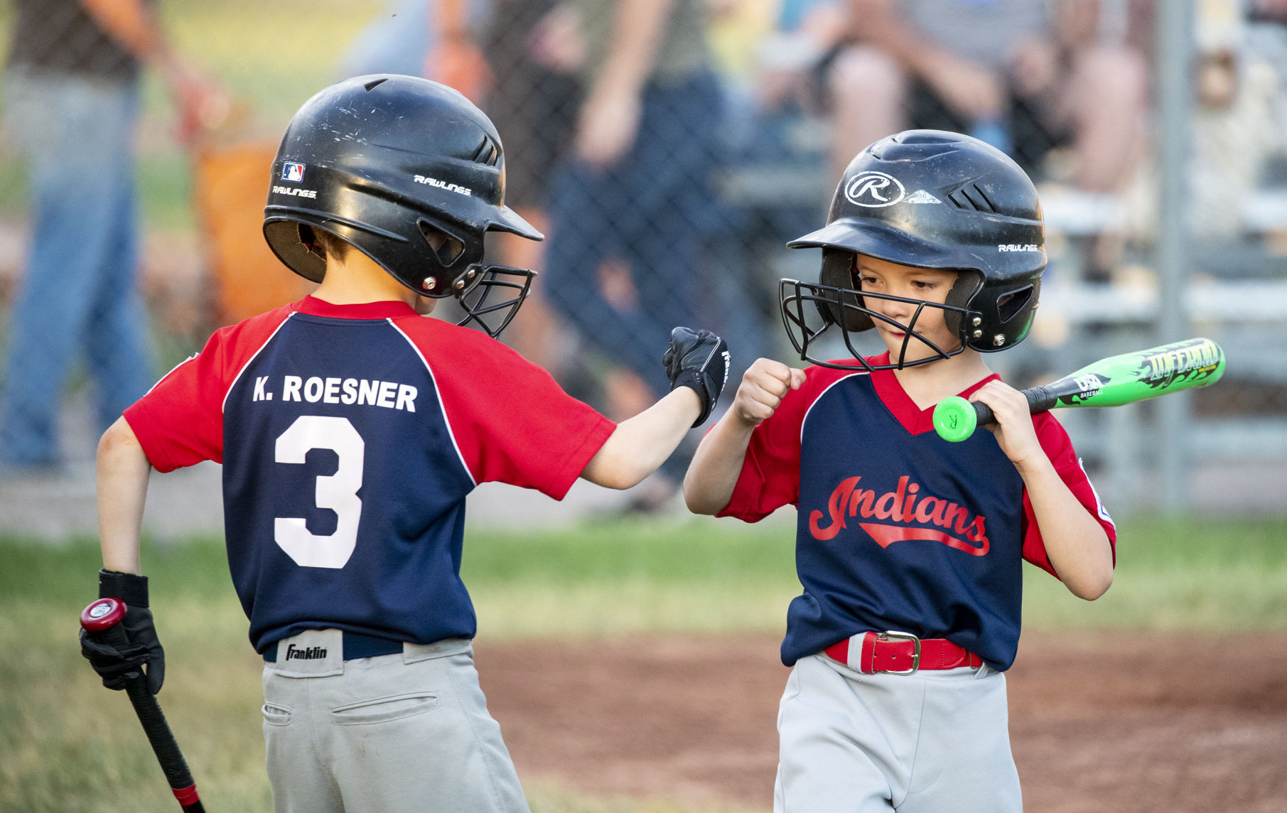 Law enforcement pair coach their sons in little league baseball